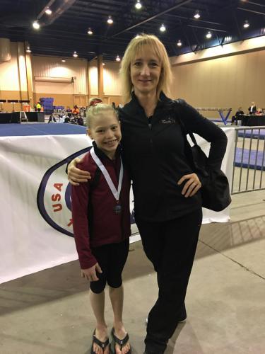 Hannah Sitzman and Coach Katia Shchennikova after Hopes Elite Optional Qualifier meet at the 2017 City of Lights Invitational in Florida